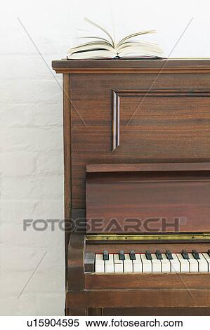 Open book on piano View Large Photo Image Stock Photography - Open book on piano. Fotosearch