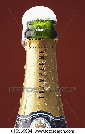 Open champagne bottle overflowing View Large Photo Image Picture - Open champagne bottle overflowing. Fotosearch