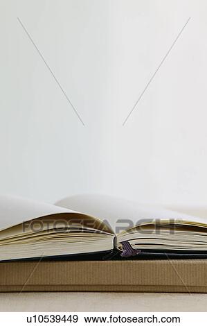 Open notebook on paper box studio shot View Large Photo Image Stock Photo - Open notebook on paper box studio shot. Fotosearch
