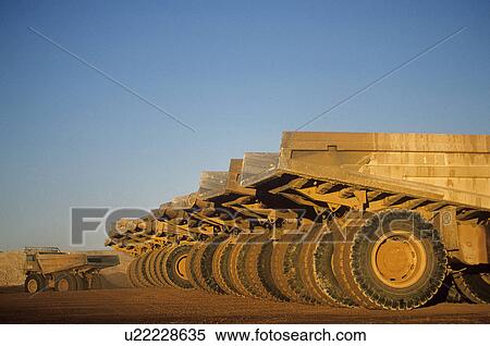 Ore hauling trucks in row Telfer Western Australia View Large Photo Image Stock Photography - Ore hauling trucks in row Telfer Western Australia. Fotosearch