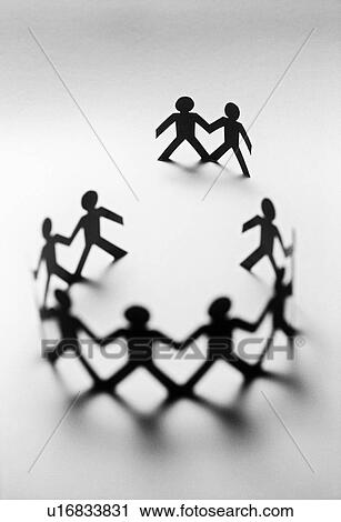 Stock Image - Paper dolls in circle with two bystanders. Fotosearch