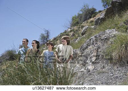 Parents with two sons (7-12) in mountains View Large Photo Image Stock Photo - Parents with two sons (7-12) in mountains. Fotosearch