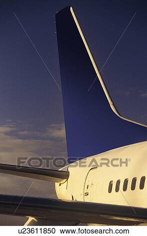 Stock Image - Passenger jet tailplane and rear fuselage. Fotosearch