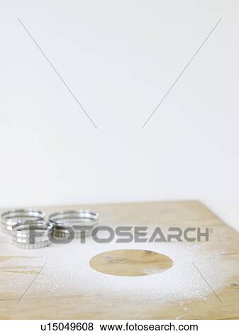 Pastry cutters and flour on table top elevated view View Large Photo Image Stock Photo - Pastry cutters and flour on table top elevated view. Fotosearch