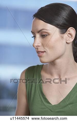 Pensive woman indoors View Large Photo Image Picture - Pensive woman indoors. Fotosearch
