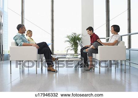 People sitting in modern waiting room View Large Photo Image Stock Image - People sitting in modern waiting room. Fotosearch
