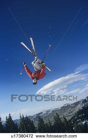 Stock Image - Person on skis jumping. Fotosearch
