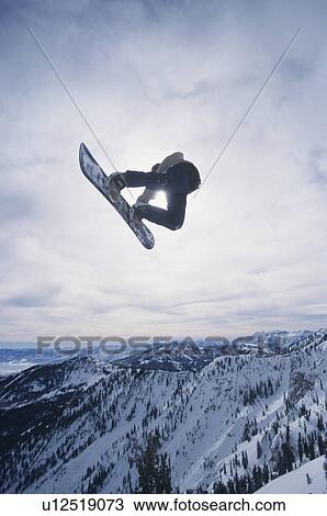 Person on snowboard jumping View Large Photo Image Stock Image - Person on snowboard jumping. Fotosearch