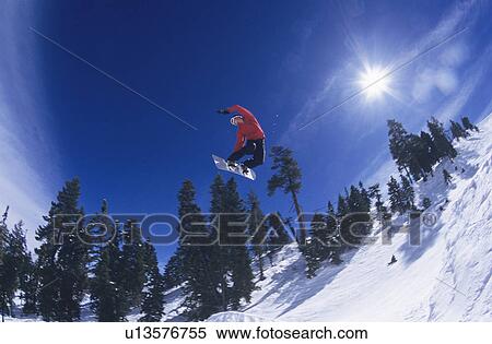 Stock Photography - Person on snowboard jumping. Fotosearch
