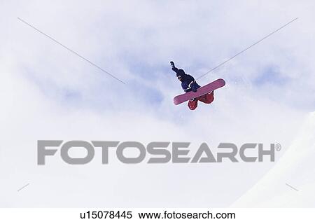 Person on snowboard jumping view from below View Large Photo Image Stock Photography - Person on snowboard jumping view from below. Fotosearch