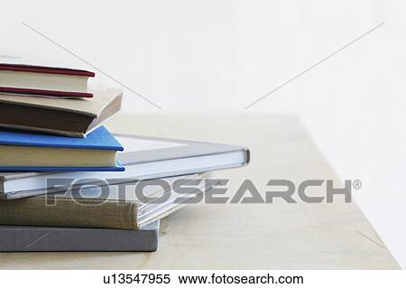 Pile of note books on table studio shot close up View Large Photo Image Stock Photography - Pile of note books on table studio shot close up. Fotosearch