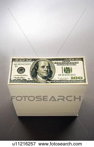 Pile of one hundred dollar bills studio shot elevated view View Large Photo Image Stock Photo - Pile of one hundred dollar bills studio shot elevated view. Fotosearch