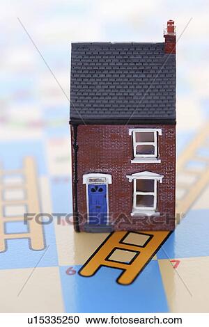 Plastic house on game board View Large Photo Image Stock Image - Plastic house on game board. Fotosearch