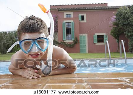 Portrait of boy (10-12) in pool wearing snorkelling mask View Large Photo Image Stock Photo - Portrait of boy (10-12) in pool wearing snorkelling mask. Fotosearch