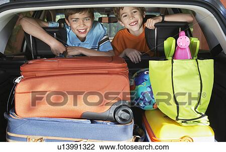 Portrait of boys (6-11) in loaded car View Large Photo Image Stock Image - Portrait of boys (6-11) in loaded car. Fotosearch