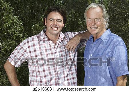 Portrait of father and adult son in garden View Large Photo Image Stock Image - Portrait of father and adult son in garden. Fotosearch