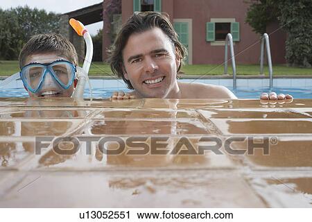 Portrait of father and son (10-12) in pool boy in snorkelling mask smiling View Large Photo Image Stock Image - Portrait of father and son (10-12) in pool boy in snorkelling mask smiling. Fotosearch