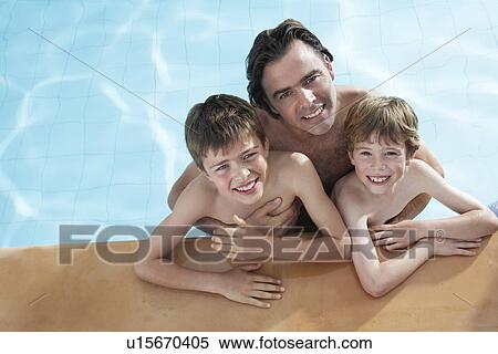 Portrait of father with two sons (5-11) in swimming pool elevated view View Large Photo Image Stock Photography - Portrait of father with two sons (5-11) in swimming pool elevated view. Fotosearch