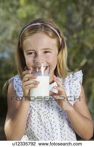 Portrait of girl (5-6) drinking milk View Large Photo Image Stock Image - Portrait of girl (5-6) drinking milk. Fotosearch