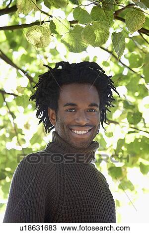 Portrait of man under tree View Large Photo Image Stock Image - Portrait of man under tree. Fotosearch
