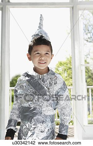 Portrait of young boy (5-6) wearing aluminum foil knight costume indoors View Large Photo Image Stock Image - Portrait of young boy (5-6) wearing aluminum foil knight costume indoors. Fotosearch