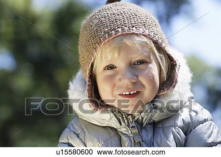 Portrait of young girl (3-4) in winter clothes outdoors View Large Photo Image Stock Image - Portrait of young girl (3-4) in winter clothes outdoors. Fotosearch