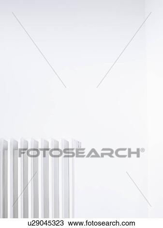 Radiator against white wall View Large Photo Image Stock Image - Radiator against white wall. Fotosearch
