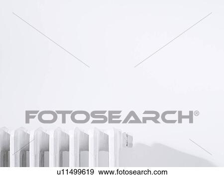 Radiator against white wall View Large Photo Image Stock Photo - Radiator against white wall. Fotosearch