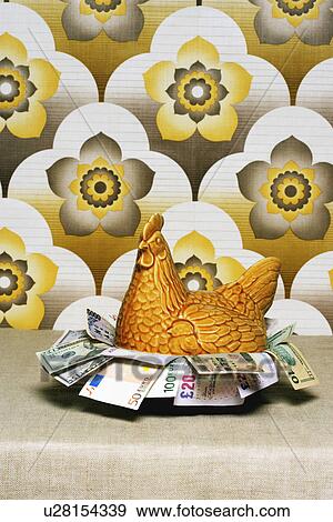 Retro chicken shaped container full of Euros wallpaper View Large Photo Image Stock Photo - Retro chicken shaped container full of Euros wallpaper. Fotosearch