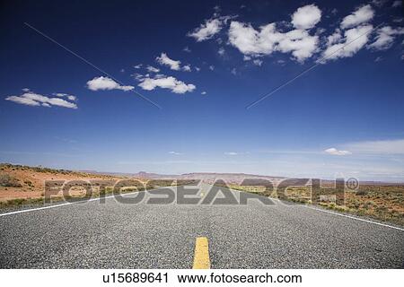 Stock Image - Road through desert. Fotosearch