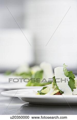 Salad with grated cheese on a plate View Large Photo Image Stock Image - Salad with grated cheese on a plate. Fotosearch