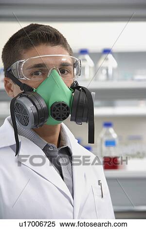 Stock Photography - Scientist wearing a gas mask in laboratory. Fotosearch