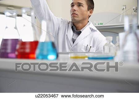 Stock Photo - Scientist working in laboratory. Fotosearch