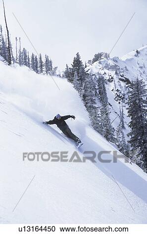 Snowboarder on slope elegated view View Large Photo Image Stock Image - Snowboarder on slope elegated view. Fotosearch