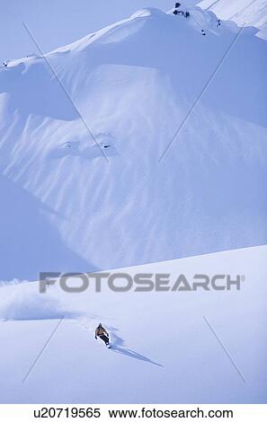 Snowboarder on slope elegated view View Large Photo Image Stock Photography - Snowboarder on slope elegated view. Fotosearch