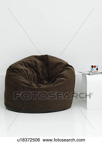 Stock Photograph - Soft chair in white room. Fotosearch