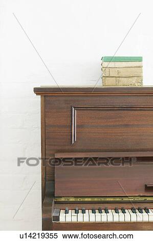 Stack of books on piano View Large Photo Image Stock Photography - Stack of books on piano. Fotosearch