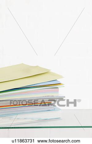 Stack of coloured stationery studio shot View Large Photo Image Stock Image - Stack of coloured stationery studio shot. Fotosearch