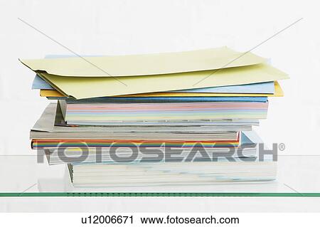 Stack of coloured stationery studio shot View Large Photo Image Stock Image - Stack of coloured stationery studio shot. Fotosearch
