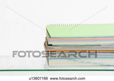 Stack of coloured stationery studio shot View Large Photo Image Stock Photograph - Stack of coloured stationery studio shot. Fotosearch