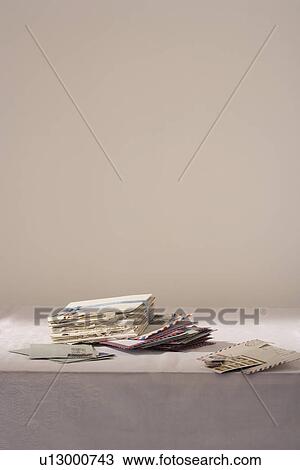 Stock Image - Stack of letters on table. Fotosearch
