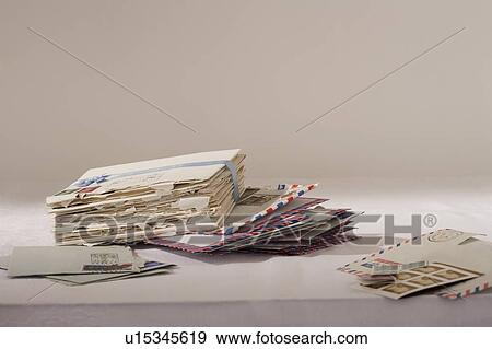 Stack of letters on table View Large Photo Image Stock Photo - Stack of letters on table. Fotosearch