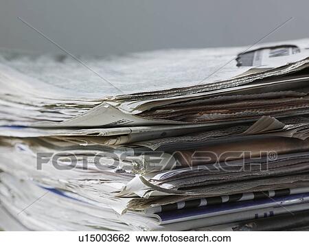 Stock Image - Stack of newspapers close up. Fotosearch