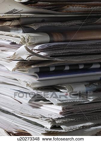 Stock Photo - Stack of newspapers close up. Fotosearch