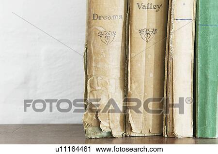 Stack of old books on wooden chest close up View Large Photo Image Stock Image - Stack of old books on wooden chest close up. Fotosearch