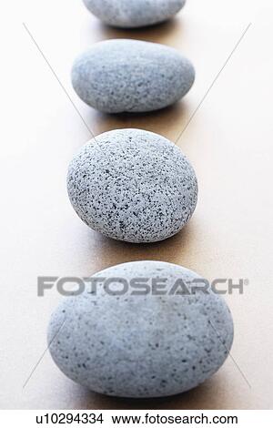 Picture - Stones in row elevated view selective focus. Fotosearch