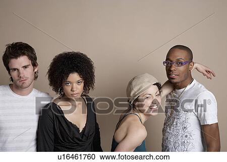 Studio portrait of four young people View Large Photo Image Stock Image - Studio portrait of four young people. Fotosearch