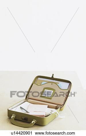 Suitcase with stationery items elevated view studio shot View Large Photo Image Stock Image - Suitcase with stationery items elevated view studio shot. Fotosearch