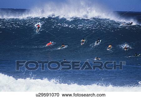 Surfers paddling out to catch wave View Large Photo Image Stock Image - Surfers paddling out to catch wave. Fotosearch
