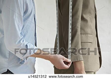 Tailor measuring jacket sleeve on man side view close up mid section View Large Photo Image Stock Image - Tailor measuring jacket sleeve on man side view close up mid section. Fotosearch